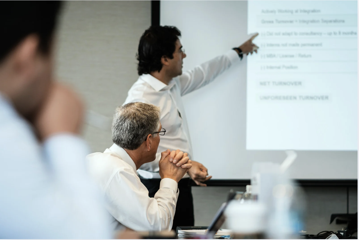 People taking notes at a conference