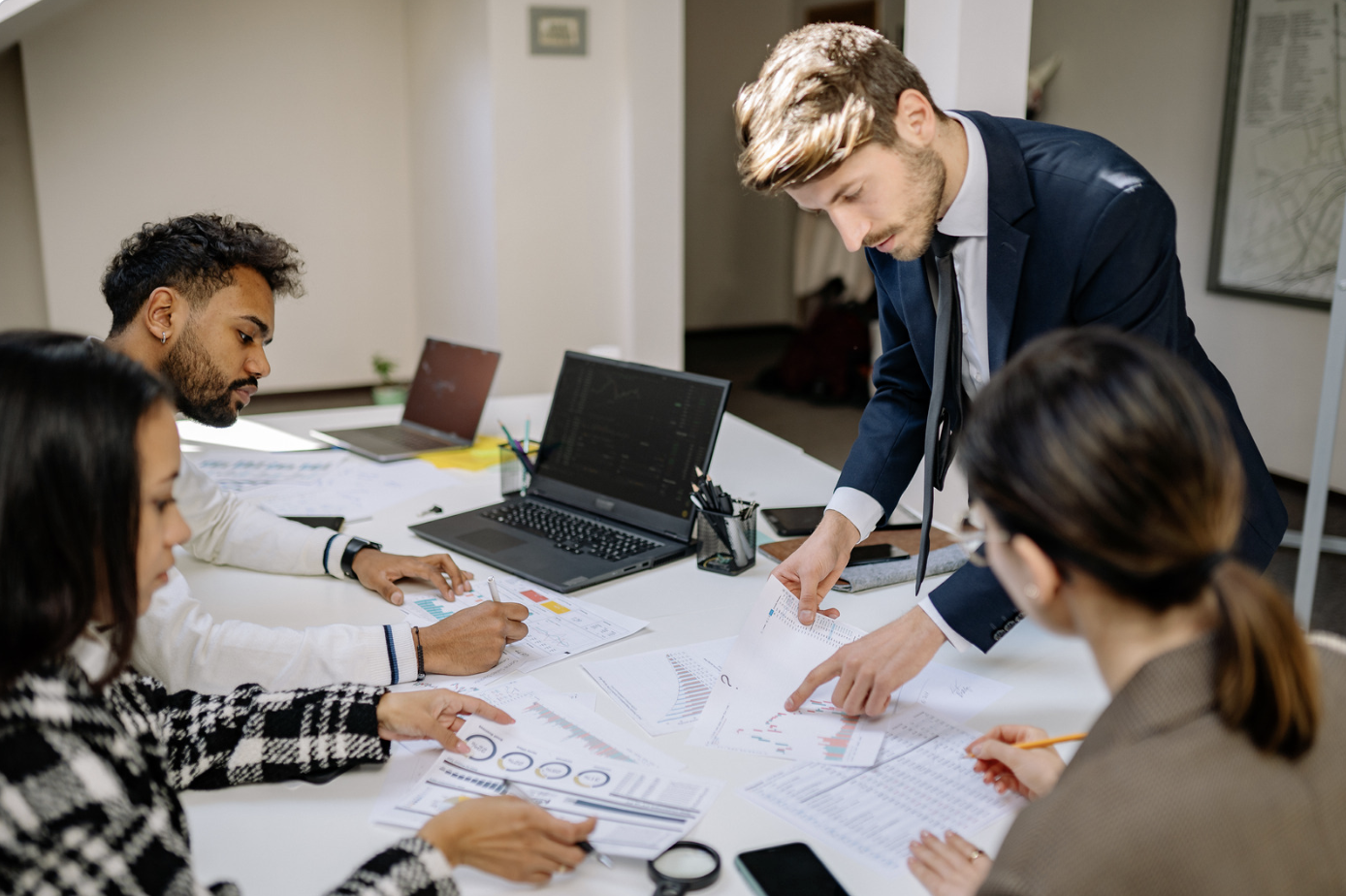 Business plan graphic being studied by two people